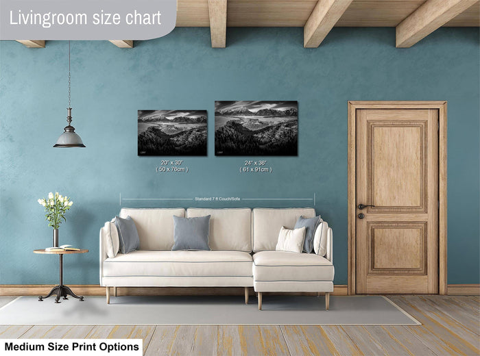 a living room with a white sofa, a wooden door, and a painting of a landscape on the wall. The living room appears to be designed for relaxation and comfort, with a focus on the artwork and the overall aesthetic.