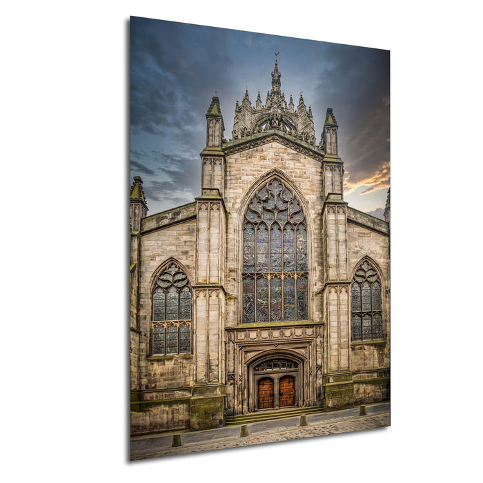 a large, ornate stone church with a tall spire and a stained glass window above the entrance.