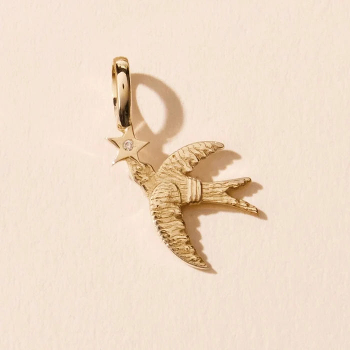 Starbound Swallow Bird Charm in 10k yellow gold with brilliant diamond, alternate angle detail view