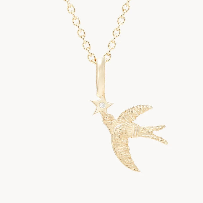 Starbound Swallow Bird Charm in 10k yellow gold with brilliant diamond, alternate angle detail view 3