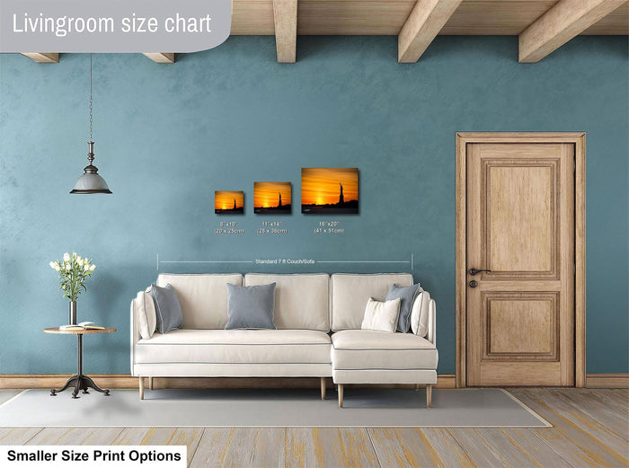 a living room with a white sofa, a wooden door, and a hanging light fixture. There are three framed pictures hanging on the wall above the sofa, and the text indicates that the living room is designed for smaller size print options.