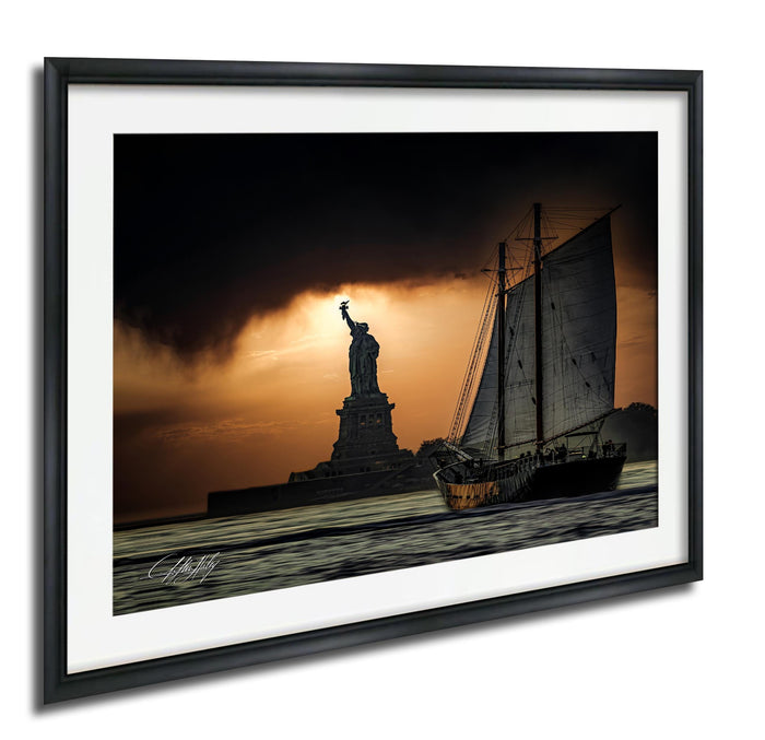 a sailboat sailing on the water, with the Statue of Liberty in the background, against a dramatic orange and black sky.