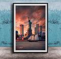 a framed photograph of the Statue of Liberty in New York City, with the city skyline in the background and a sailboat in the foreground.