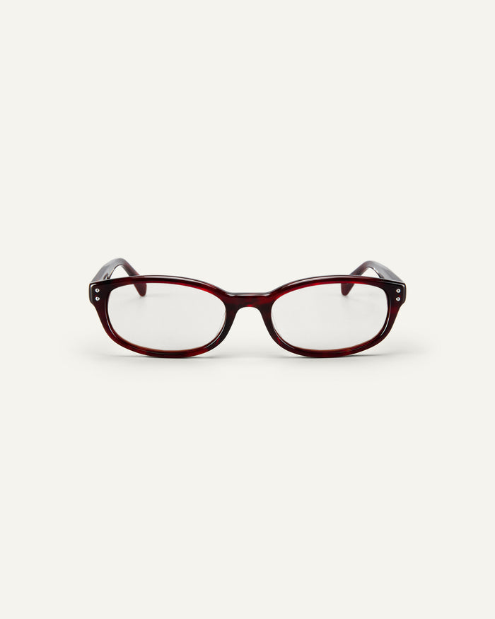 Face shot of Bonnie Clyde Sudoku optical frames in red tortoise with clear lenses.