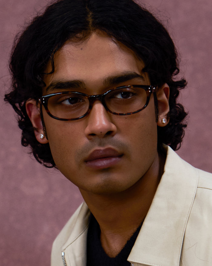 Quarter shot of Bonnie Clyde Sudoku optical frames in tortoise with clear lenses.