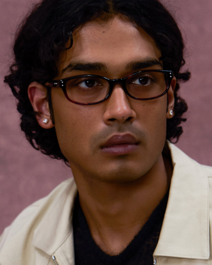Quarter shot of Bonnie Clyde Sudoku optical frames in red tortoise with clear lenses.