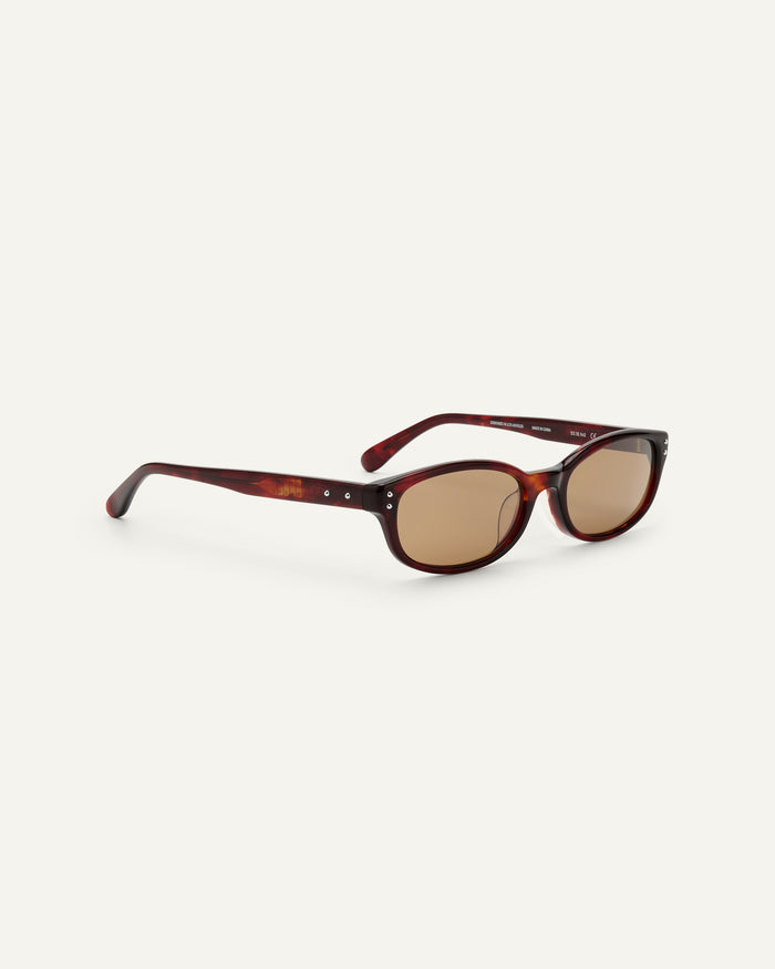 Side shot of Bonnie Clyde Sudoku sunglasses in red tortoise with brown lenses.