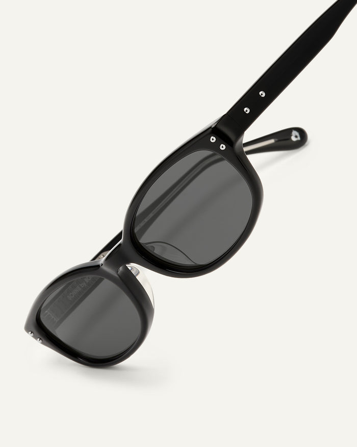 Close-up shot of Bonnie Clyde Sudoku sunglasses in black with black lenses.