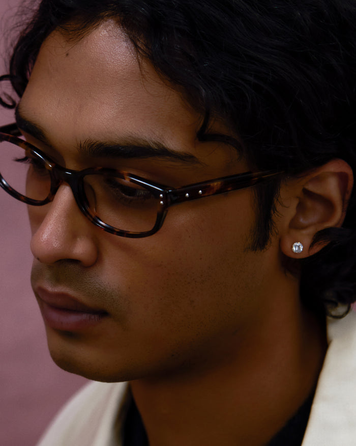Close-up shot of Bonnie Clyde Sudoku optical frames in tortoise with clear lenses.