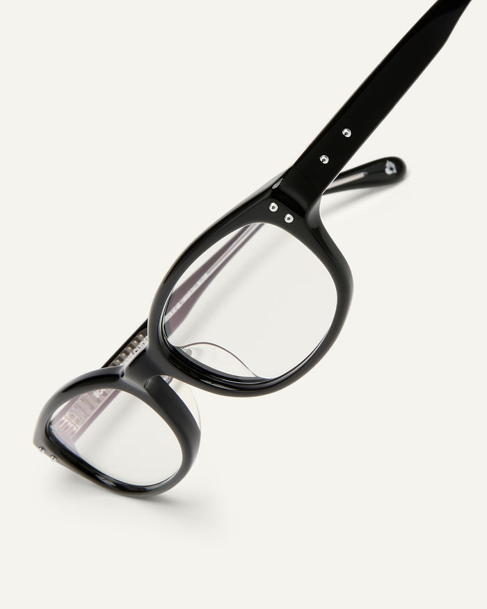 Detail shot of Bonnie Clyde Sudoku optical frames in black with clear lenses.