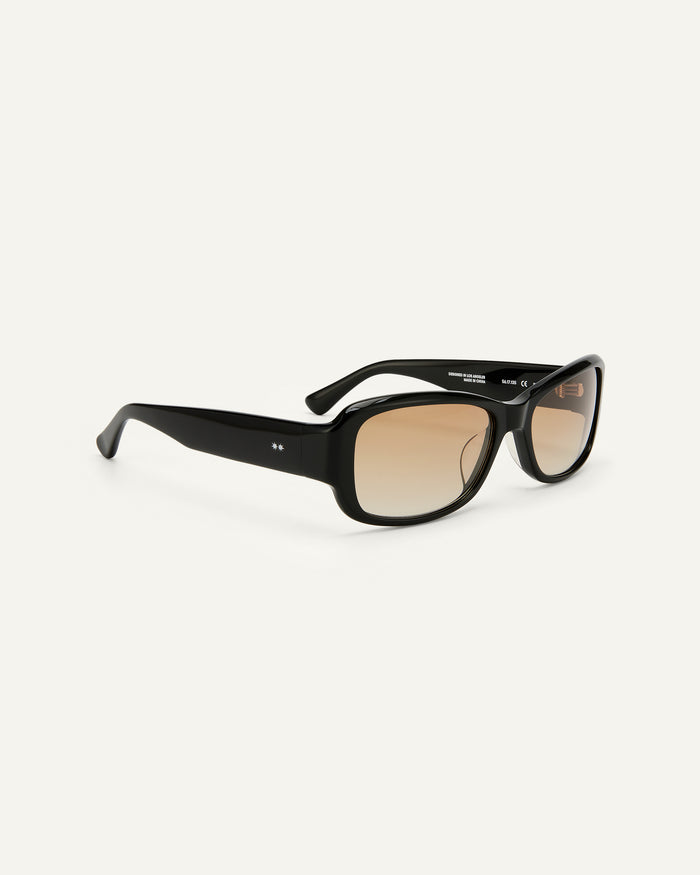 Side shot of Bonnie Clyde Sugar sunglasses in black with brown lenses.