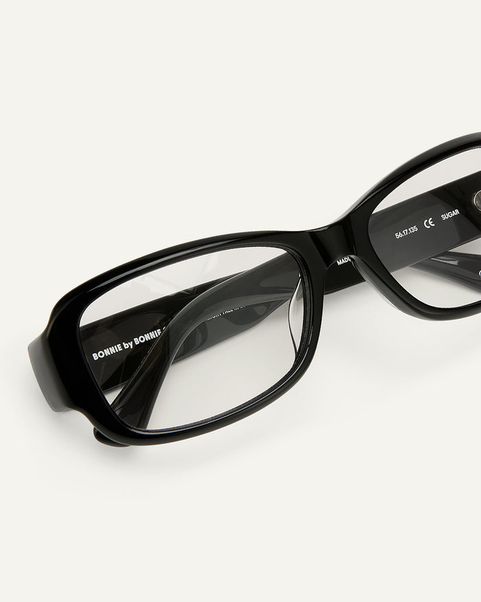 Close-up shot of Bonnie Clyde Sugar optical frames in black with clear lenses.