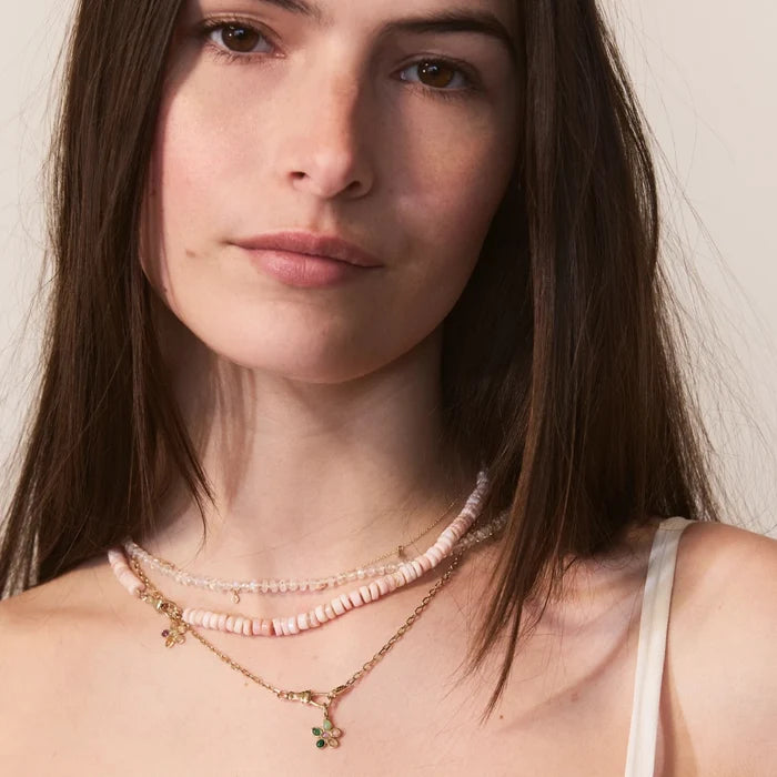 Sunset Forget-me-not Pink Flower Charm in 10k yellow gold, shown worn on hand 2