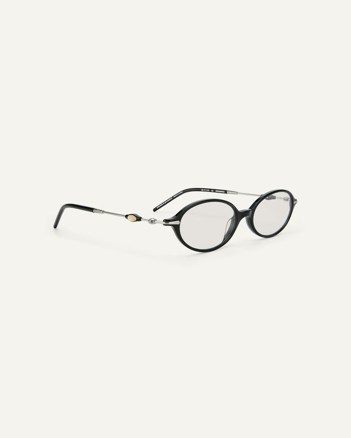 Side shot of Bonnie Clyde Swimming optical frames in silver and black with clear lenses.