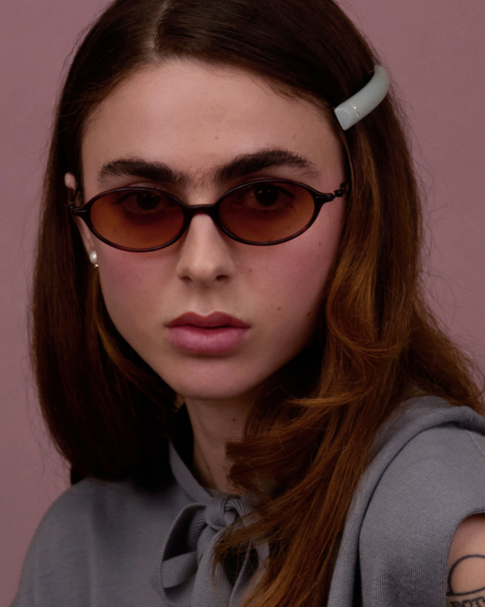 Side shot of Bonnie Clyde Swimming sunglasses in black and red tortoise with brown gradient lenses.