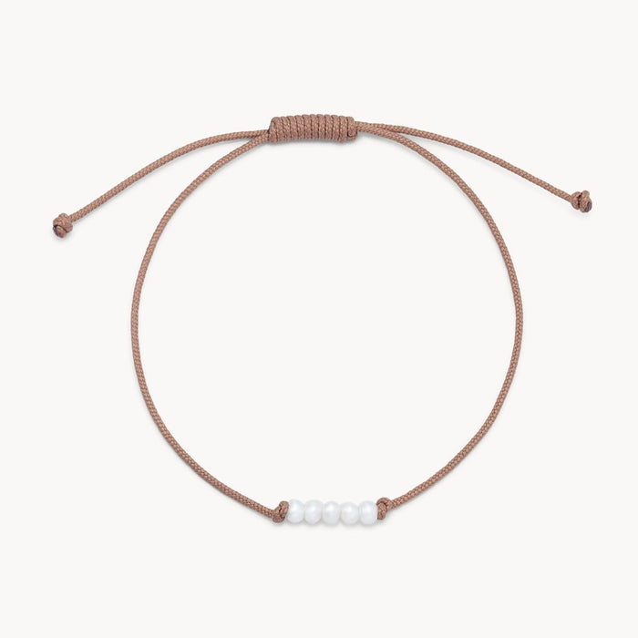 The Abacus Pearl Contemplation Cord Bracelet with taupe cord
