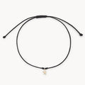 The Bright Star Contemplation Cord Bracelet in 10k yellow gold with black cord