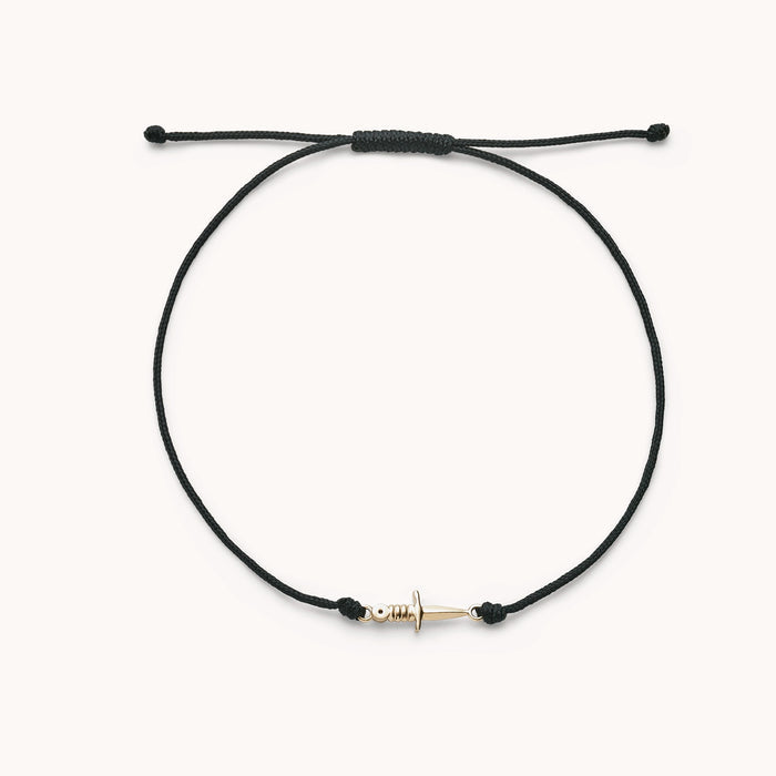 The Dagger Contemplation Cord Bracelet in 10k yellow gold with black cord