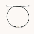 The Dagger Contemplation Cord Bracelet in 10k yellow gold with black cord