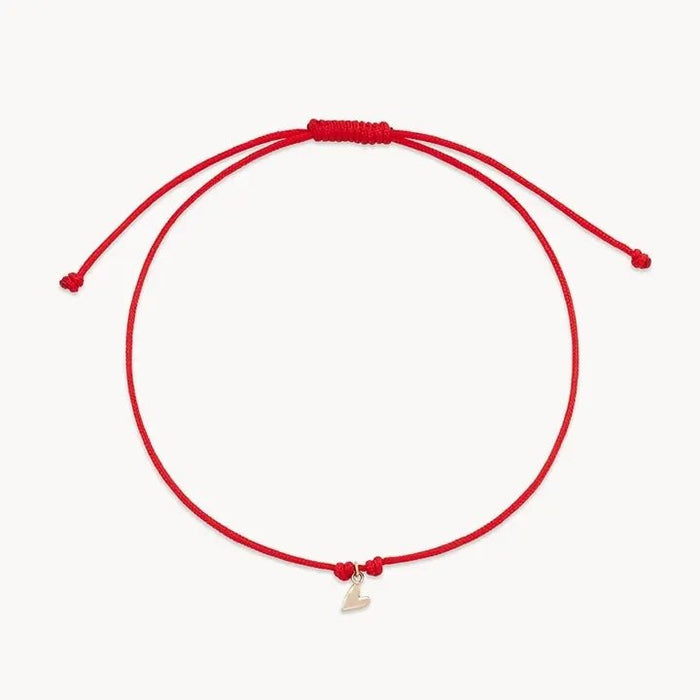 The Deep Love Contemplation Cord Bracelet in 10k yellow gold with red cord