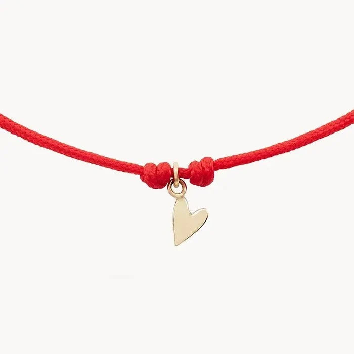 The Deep Love Contemplation Cord Bracelet in 10k yellow gold with red cord, alternate angle detail view 4