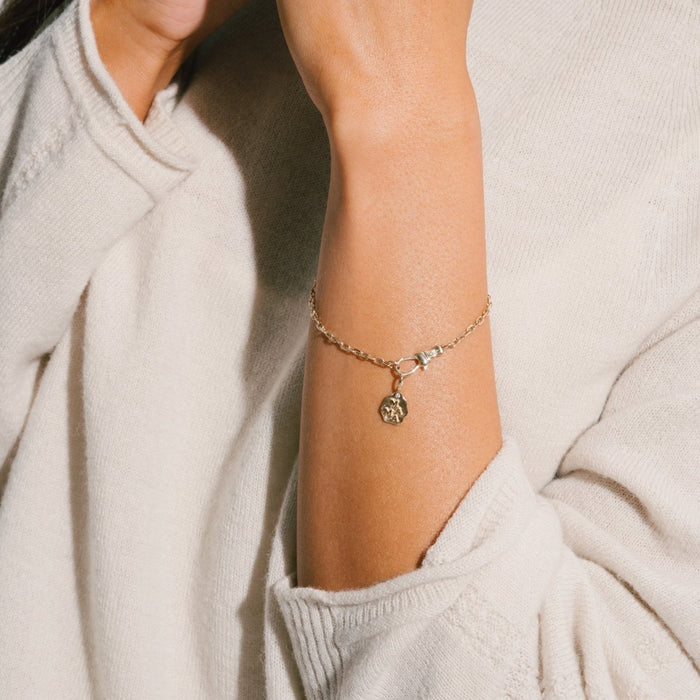 The Mama Charm in 10k yellow gold, alternate angle detail view