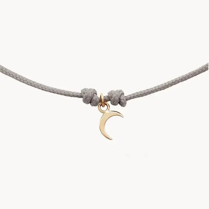 The Moon Phases Contemplation Cord Bracelet in 10k yellow gold with grey cord, alternate angle detail view 3