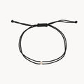 The Nova Diamond Black Cord Bracelet in 10k yellow gold with diamond and black nylon
