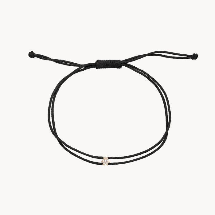 The Nova Diamond Black Cord Bracelet in 10k yellow gold with diamond and black nylon