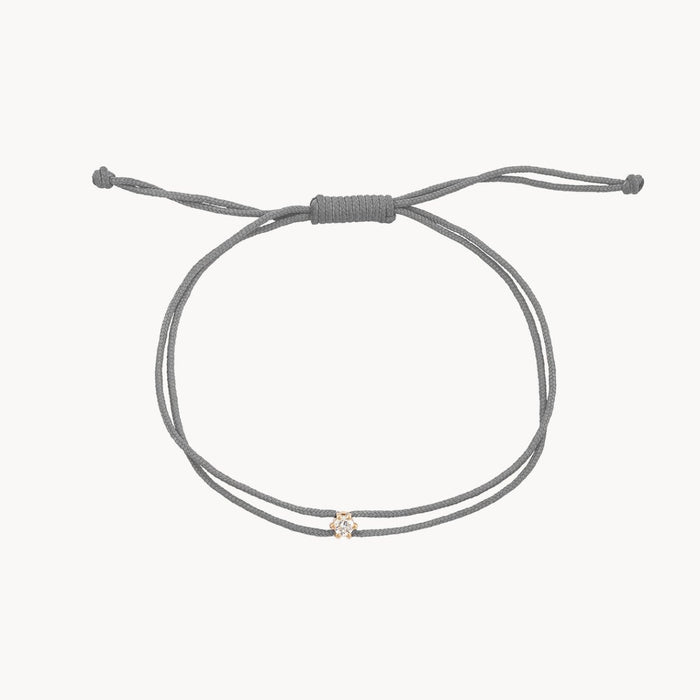 The Nova Diamond Grey Cord Bracelet in 10k yellow gold with diamond and grey nylon