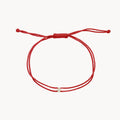 The Nova Diamond Red Cord Bracelet in 10k yellow gold with diamond and red nylon