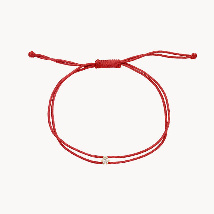 The Nova Diamond Red Cord Bracelet in 10k yellow gold with diamond and red nylon