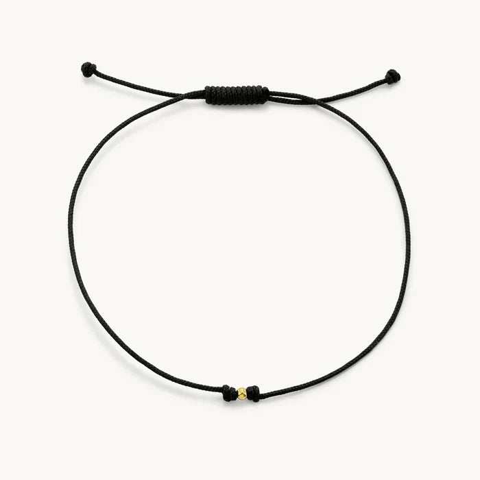 The One Cord Bracelet in 10k yellow gold with black cord