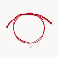 The Open Heart Cord Bracelet in sterling silver with diamond and light red cord