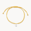The Open Heart Cord Bracelet in sterling silver with diamond and yellow cord