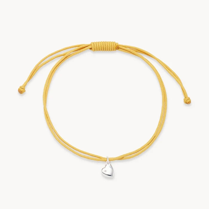 The Open Heart Cord Bracelet in sterling silver with diamond and yellow cord