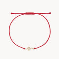The Serpent Contemplation Cord Bracelet in 10k yellow gold with red cord