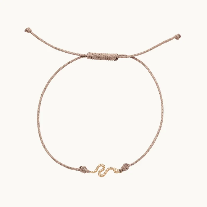 The Serpent Contemplation Cord Bracelet in 10k yellow gold with taupe cord