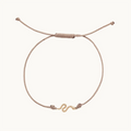 The Serpent Contemplation Cord Bracelet in 10k yellow gold with taupe cord