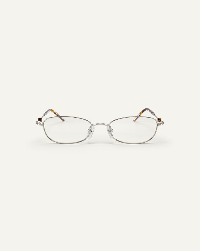 Face shot of Bonnie Clyde Tiptoe optical frames in silver with clear lenses.