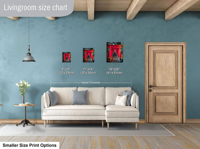 a living room with a white sofa, a wooden door, and a hanging light fixture. There are three framed artworks of different sizes displayed on the wall, with the largest one being 11 x 14" and the smallest one being 8 x 10".