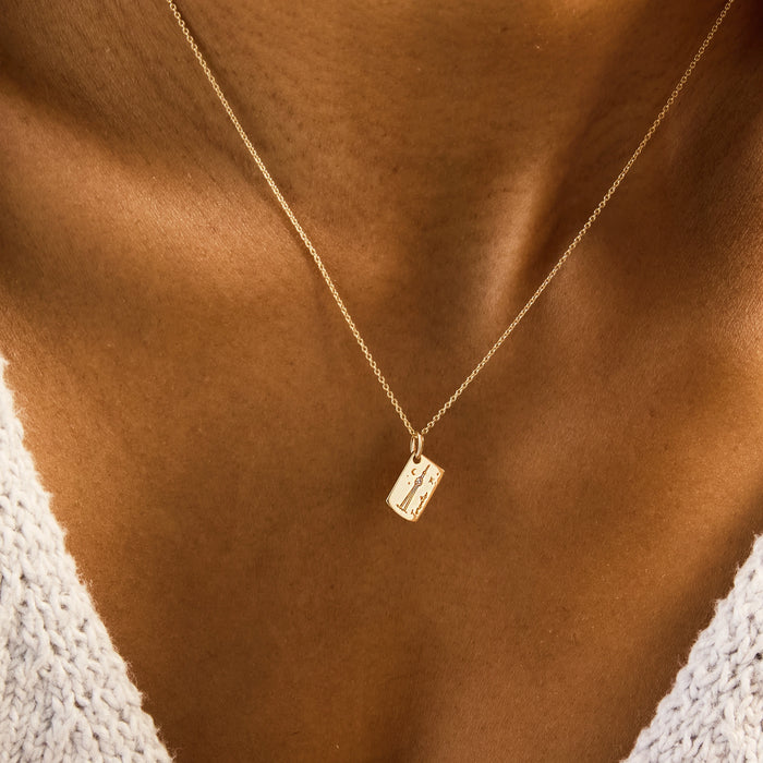 Toronto Postcard Charm in 10k yellow gold with brilliant diamond, shown worn on hand