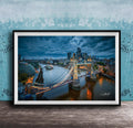 A framed photograph of the London skyline at night, featuring the iconic Tower Bridge and the River Thames.