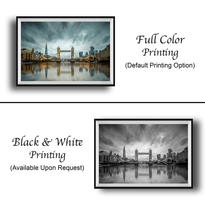The image is a collage of two framed photographs. The top photograph is a full color print of the Tower Bridge in London, while the bottom photograph is a black and white print of the same bridge. Both prints are framed and available upon request.
