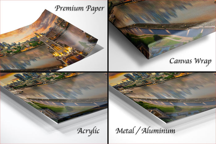four different views of a cityscape, including a close-up of a bridge, a panoramic view of the city, and a close-up of a river. The text labels the different views as "Premium Paper", "Canvas Wrap", "Acrylic", and "Metal/Aluminum".