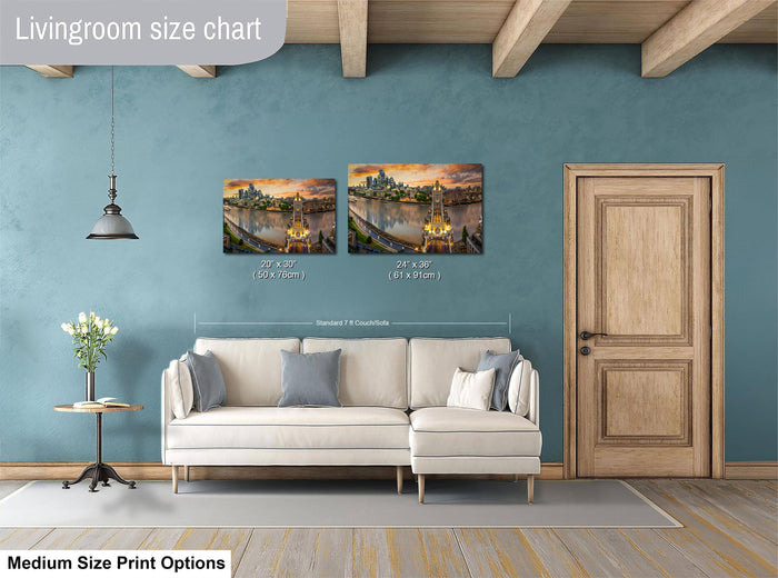 a living room with a white sofa, a wooden door, and a painting of a cityscape on the wall. The living room appears to be well-lit and decorated with various items, such as a vase of flowers and a book.
