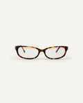 Face shot of Bonnie Clyde Trinket sunglasses in tortoise with clear lenses.