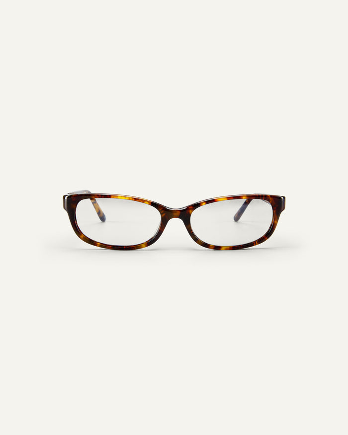 Face shot of Bonnie Clyde Trinket sunglasses in tortoise with clear lenses.