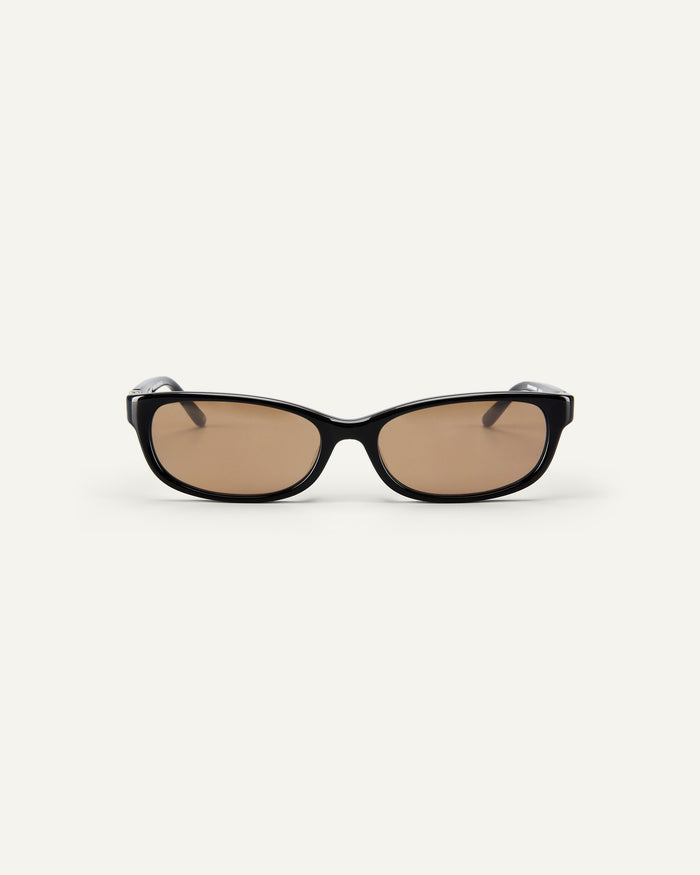 Face shot of Bonnie Clyde Trinket sunglasses in black with brown lenses.