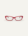 Face shot of Bonnie Clyde Trinket sunglasses in layered red with clear lenses.
